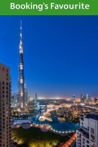a city skyline with the shard and a river at The residences 1 - Luxury 1BR apt in Downtown Dubai - 2 mins walk to Burj Khalifa & Dubai Mall in Dubai