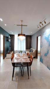 a living room with a table and a couch at Sky Suites Luxury Home KLCC in Kuala Lumpur