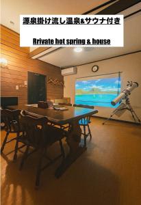 a living room with a ping pong table and a telescope at 源泉掛け流し温泉付き貸別荘-Private hot spring & Private house! - THE LOOKOUT KUSATSU in Kusatsu