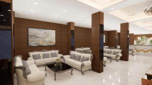 a waiting room with couches and chairs in a building at Abharam Retreats in Ghaziabad