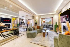 a living room with a couch and a fireplace at Prestige 2BR in Marrakech
