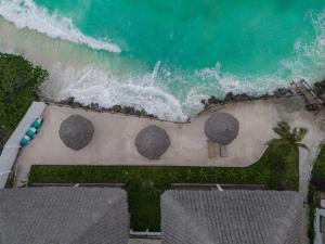 an aerial view of the beach and the ocean at Mahi Mahi Beach Hotel in Jambiani +65 photos
