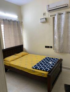 Giường trong phòng chung tại GOOD STAY T Nagar Poes