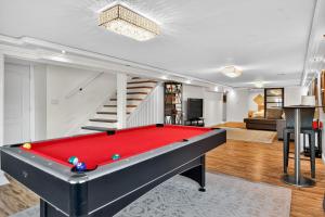 a pool table in the middle of a living room at Oceanline 180° home in Federal Way