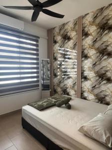 a bedroom with a bed with a stone wall at Sky28 - Sireh Residence in Kota Bharu