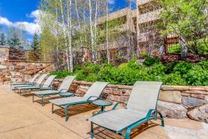 a row of chairs sitting on a patio at Sun Vail 24B in Vail