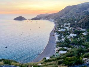 an aerial view of a beach at sunset at Hotel Maronti in Ischia