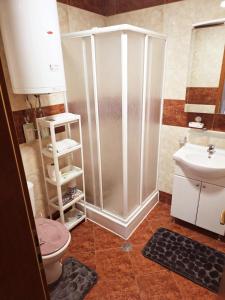 a bathroom with a shower and a toilet and a sink at Summer Dream, Nesebar Fort Club, Sunny Beach in Sunny Beach +4 photos