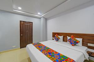 Postel nebo postele na pokoji v ubytování FabHotel Vega