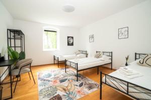 Postel nebo postele na pokoji v ubytování Central Living Apartments