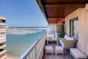 a balcony with a view of the water at Sueña Mar Luxury Suites in Torrevieja