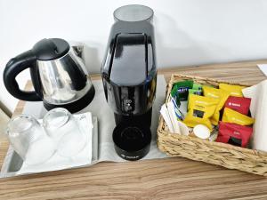 a coffee maker and a basket of food on a table at The Best Bed & Breakfast in Amantea