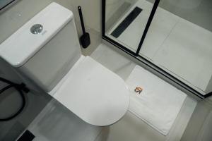 a bathroom with a white toilet and a sink at Luxury Studio Retreat in wuse2 in Abuja