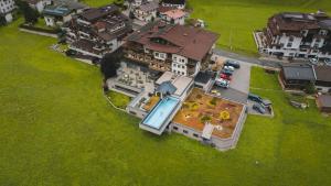 an overhead view of a large house with a yard at Natur- & Wanderhotel Tuxertal in Tux
