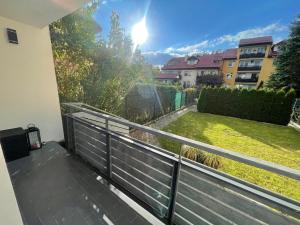 a balcony with a view of a yard at 3 Rooms Apartment in Gdańsk