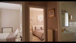 Un pat sau paturi într-o cameră la Villa Alba