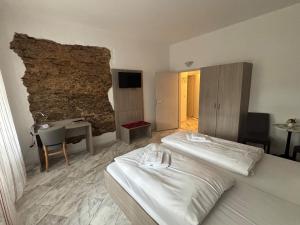a hotel room with a bed and a desk at Hotel Sächsischer Hof in Scheibenberg in Scheibenberg