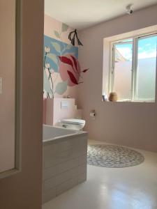 a bathroom with a sink and a window at Lovely villa for families and business traveler's in Aalborg
