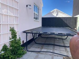 a picnic table on a patio next to a building at Lovely villa for families and business traveler's in Aalborg
