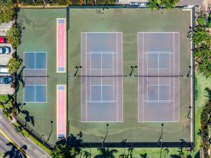 an overhead view of a tennis court with four tennis courts at Kaanapali Shores 527 · KS 527 2Bedroom w Ocean Views in BeachFro in Kahana