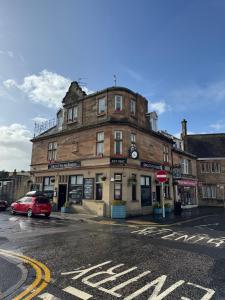 an old building on the corner of a street at Crawford House in Largs