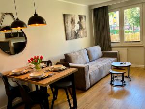 Posezení v ubytování Apartament Centrum Szczecinek - f-vat
