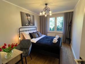 Postel nebo postele na pokoji v ubytování Apartament Centrum Szczecinek - f-vat