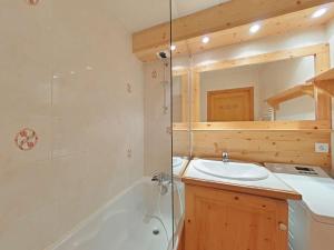a bathroom with a tub and a sink and a shower at Appt 3 pièces, 6 couchages, proche commerces et pistes, parking inclus, animaux admis - FR-1-241-177 in Le Grand-Bornand +11 photos