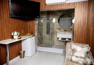 a bathroom with a shower and a sink at Beyond Borders Guest House in Polokwane +66 photos