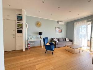 a living room with a couch and a table at Terrazza sul mare in Ladispoli