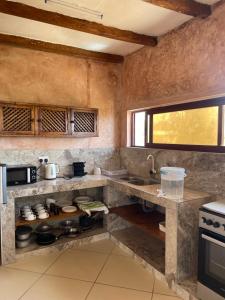 a kitchen with a counter and a sink at Watamu Villa in Watamu