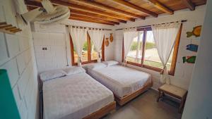 Postel nebo postele na pokoji v ubytování Cispata caribe