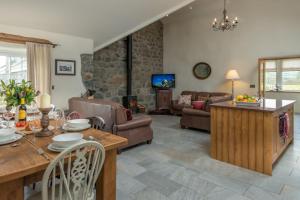 a living room with a couch and a table at Deri-Sarn in Sarn