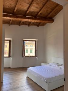 Ένα ή περισσότερα κρεβάτια σε δωμάτιο στο Casa Giulia