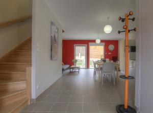 a kitchen and dining room with a table and a dining room at Les Gites de la Calonne in Guéreins