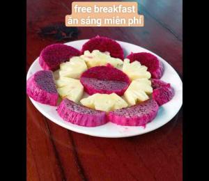 a plate of red and white cakes on a table at Palafita Bungalow in Phong Nha