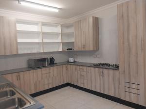 Kuchyň nebo kuchyňský kout v ubytování Grace Stays