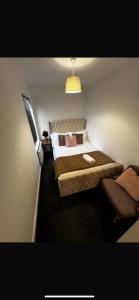 Ένα ή περισσότερα κρεβάτια σε δωμάτιο στο Santana Apartments Brighton