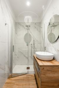 a bathroom with a sink and a shower at Carducci Collection in Bologna +52 photos