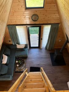 an overhead view of a living room in a tiny house at Mestia Sunrise Cottage - 1BR Cosy Stay in Svaneti in Mestia