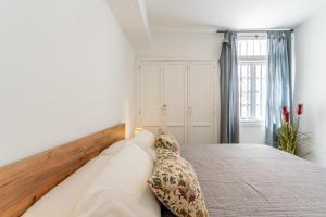 Postel nebo postele na pokoji v ubytování Renovated apartment with sunny terrace and ocean views in Malibu Park Tenerife + 62 fotografií