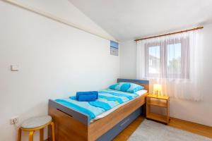 Ένα ή περισσότερα κρεβάτια σε δωμάτιο στο Residence Tomani with XXL pool +55 φωτογραφίες