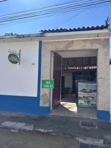 a building with a sign that reads tax nacs at Pousada Acquarela Paraty in Paraty