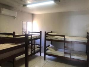 a room with several bunk beds in it at Hostel JK in Bom Jesus
