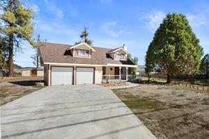 a house with a driveway in front of it at Bunny's Ranch - Sleeps 12, Pool Table, Ping Pong, Foosball in Big Bear City
