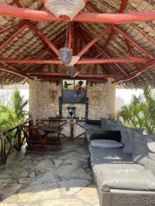 a living room with a couch and a table at Watamu 2B in Watamu