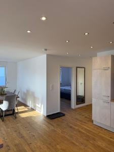 a living room with a table and a bed at Ferienwohnung Claudia in Clausen