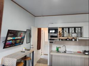 a small kitchen with a sink and a counter at Apartment near Malls in General Santos