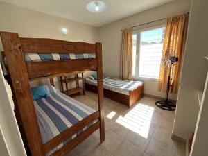 Postel nebo postele na pokoji v ubytování Complejo LA OMA, ubicado a 400 mts del mar con estacionamiento privado