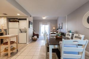 a kitchen and dining room with a table and chairs at August Breeze - Beach, Fun, Sun, Close to Sights in St. Augustine